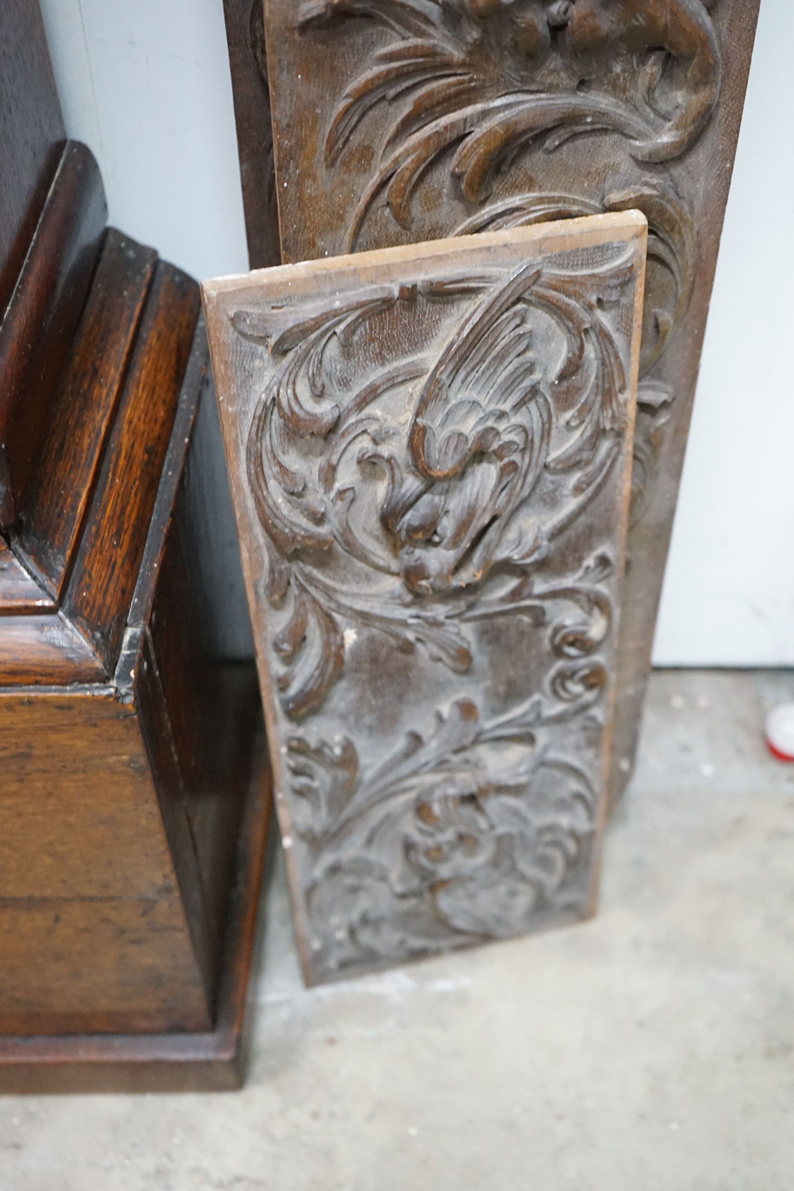 Four rectangular carved oak panels, largest length 152cm